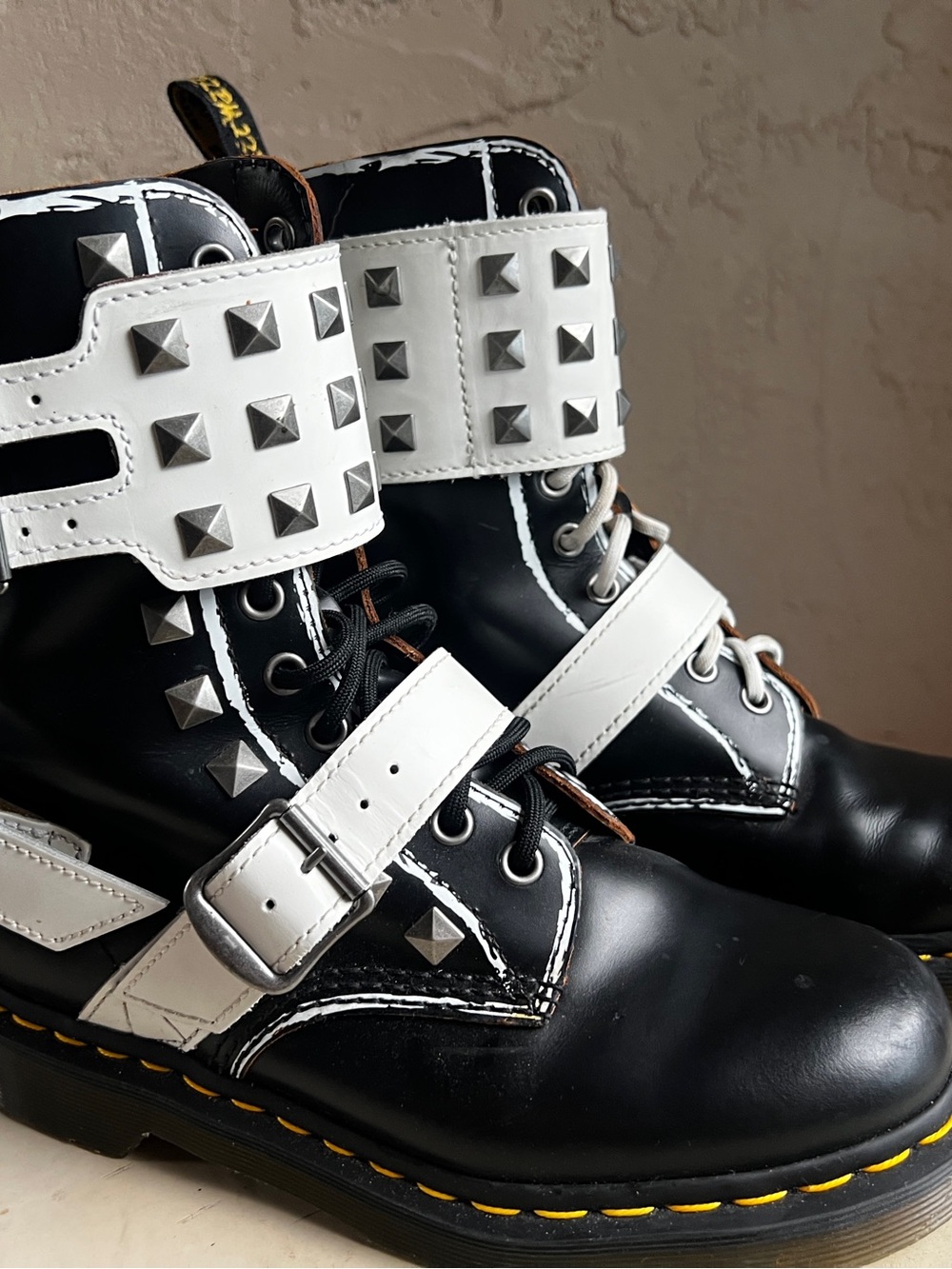 Dr. Martens Black Leather Combat Boots with White Studded Straps